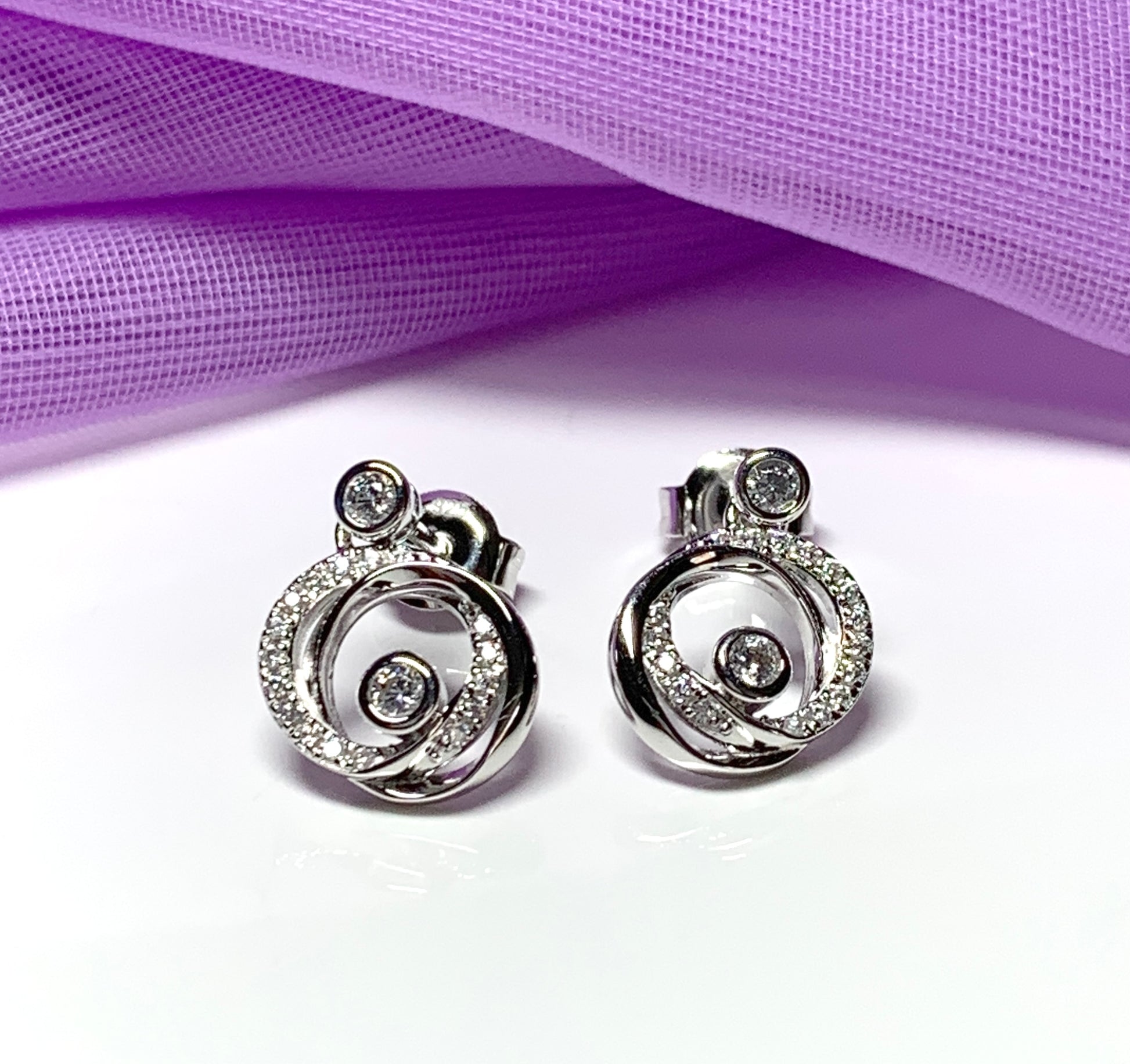 Cubic zirconia round swirl stud earrings