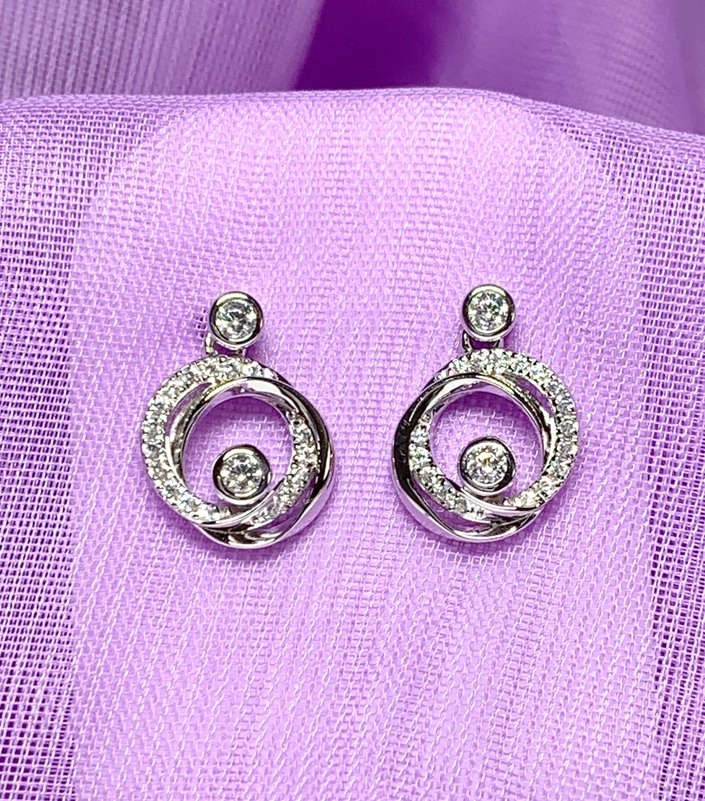 Cubic zirconia round swirl stud earrings