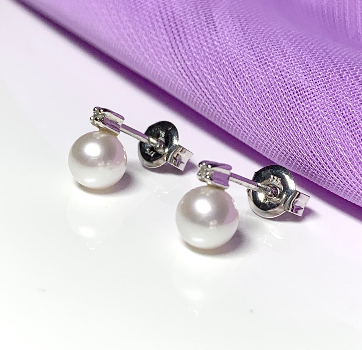 Cultured pearl and diamond stud earrings white gold