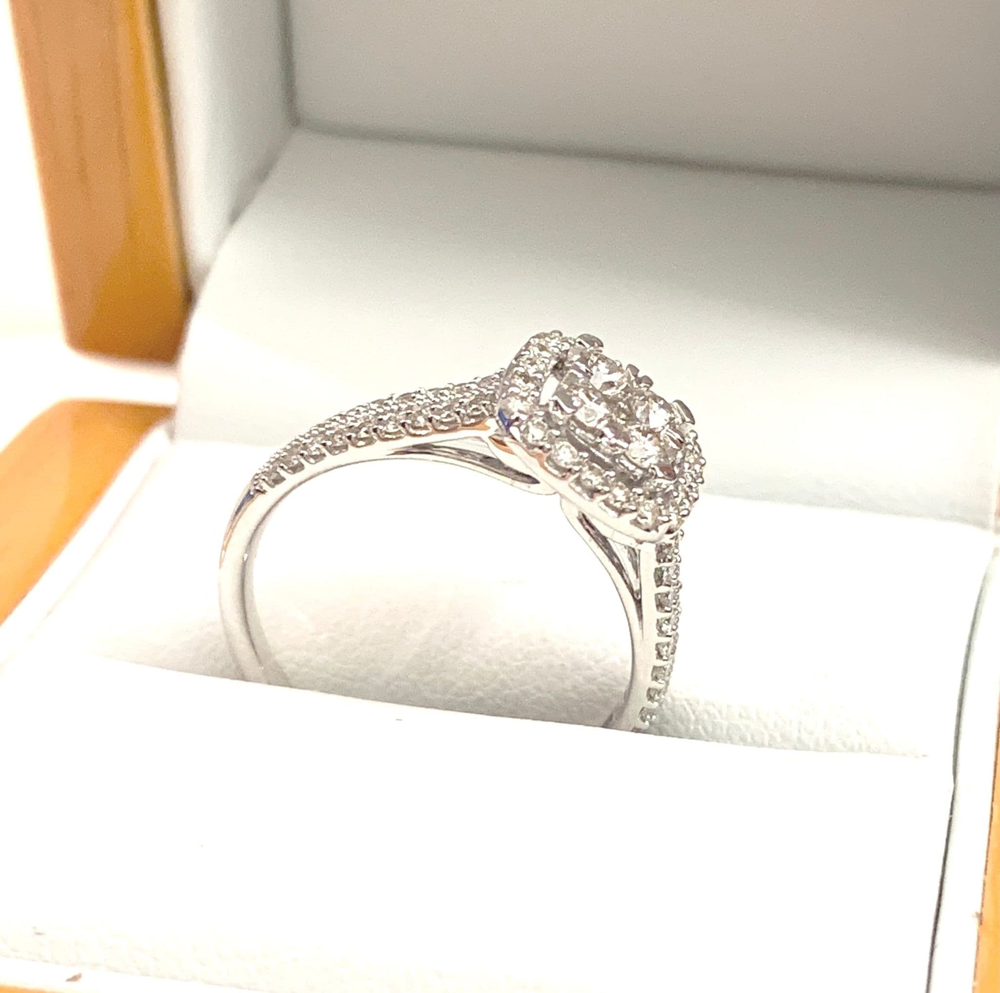 Cushion shaped diamond cluster ring engagement white gold
