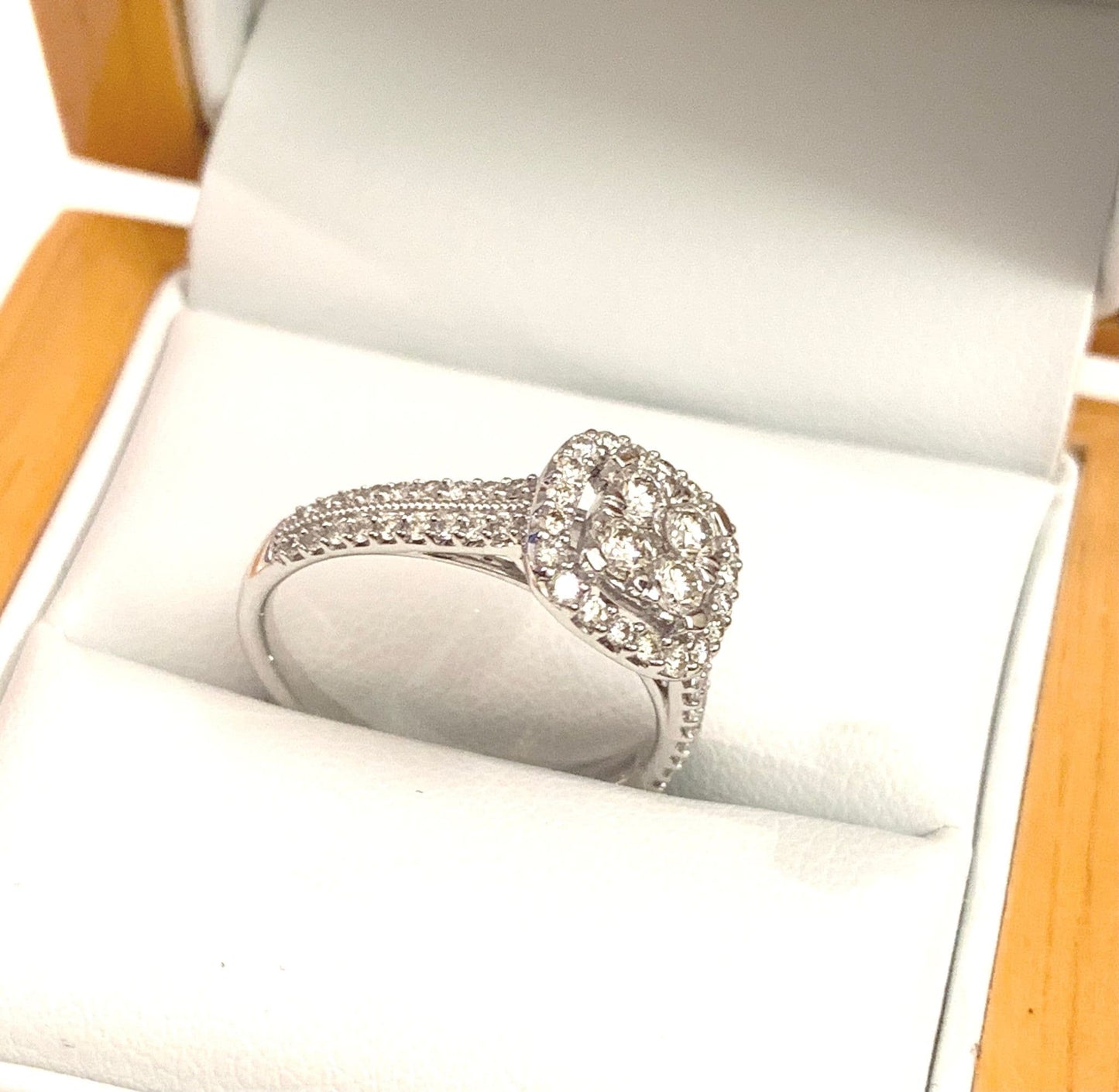 Cushion shaped diamond cluster ring engagement white gold