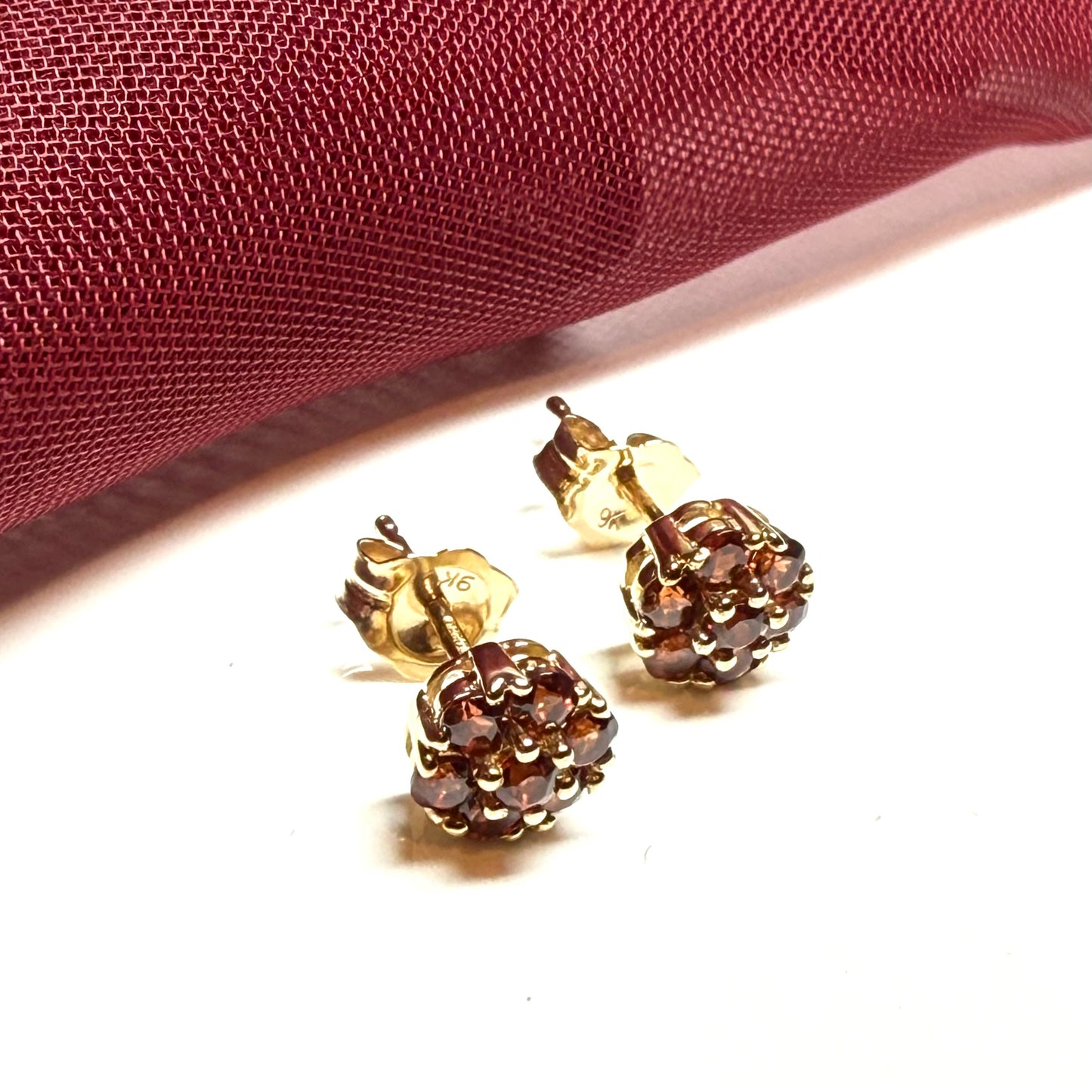 Deep red garnet yellow gold daisy cluster stud earrings