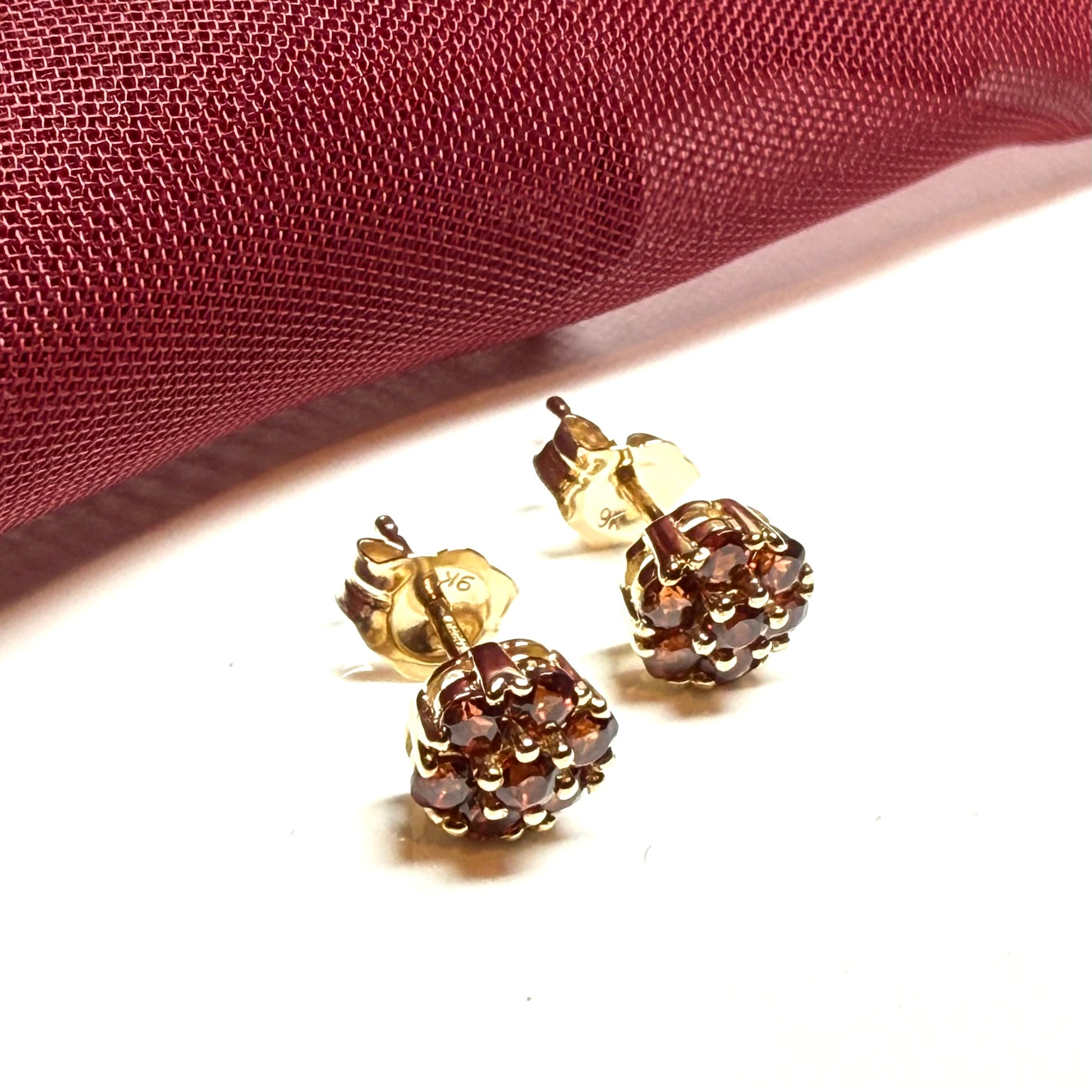 Deep red garnet yellow gold daisy cluster stud earrings