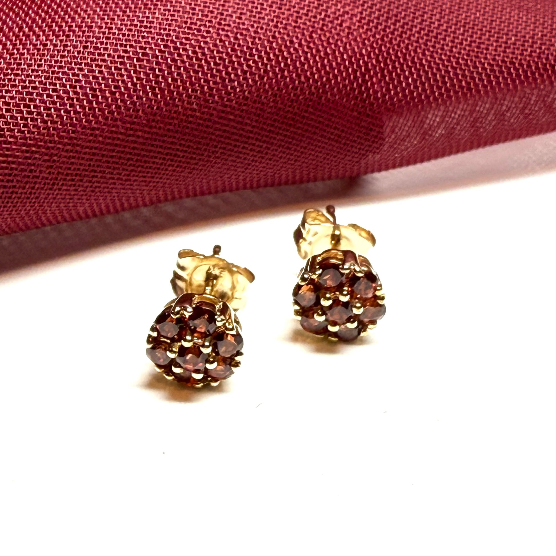Deep red garnet yellow gold daisy cluster stud earrings