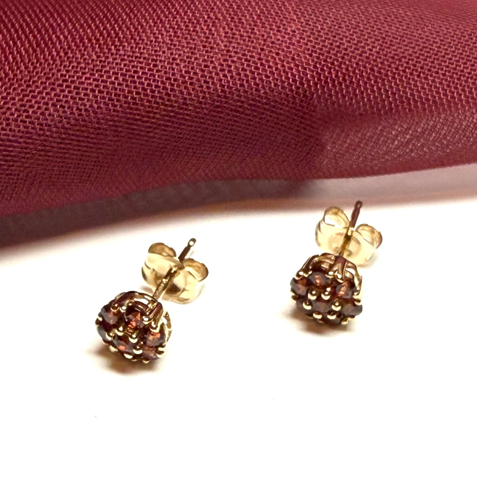 Deep red garnet yellow gold daisy cluster stud earrings