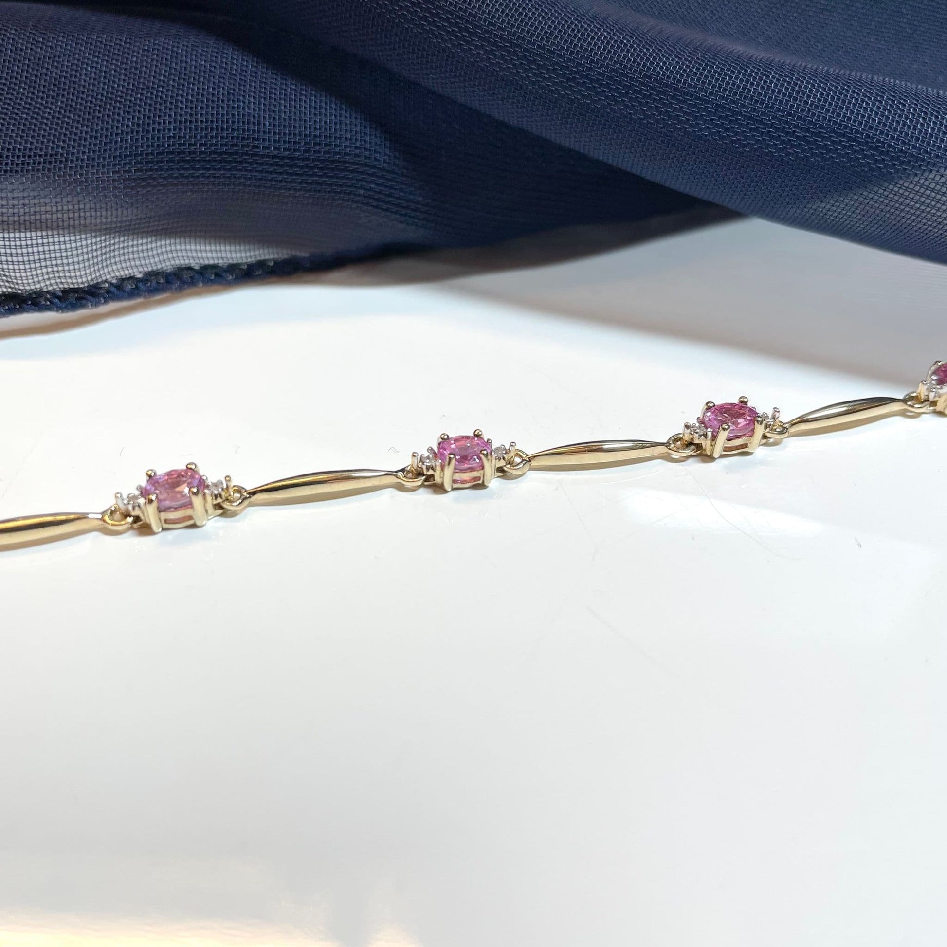 Pink sapphire and diamond yellow gold bracelet