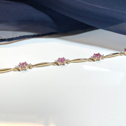 Pink sapphire and diamond yellow gold bracelet