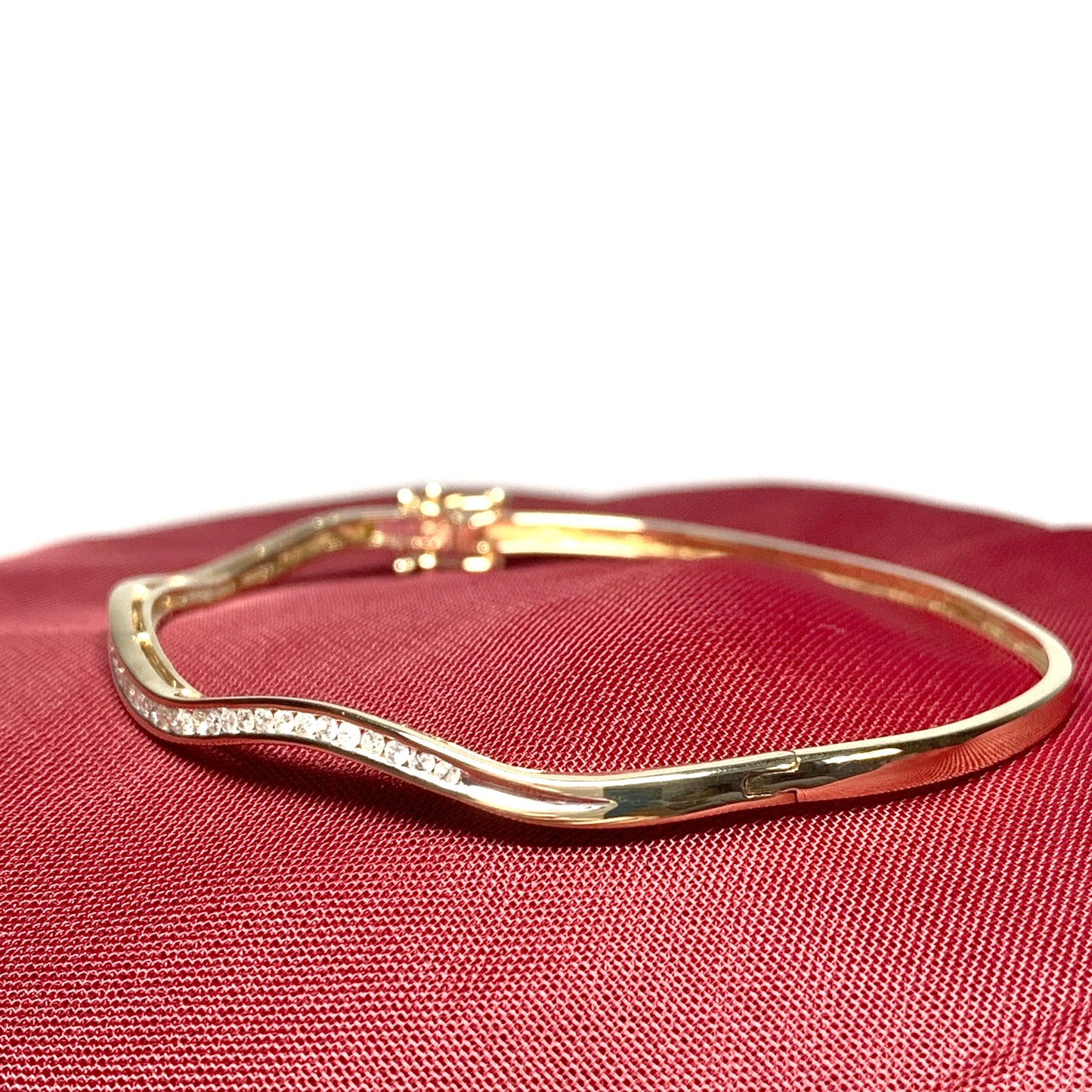 Diamond ladies bangle yellow gold wavy design