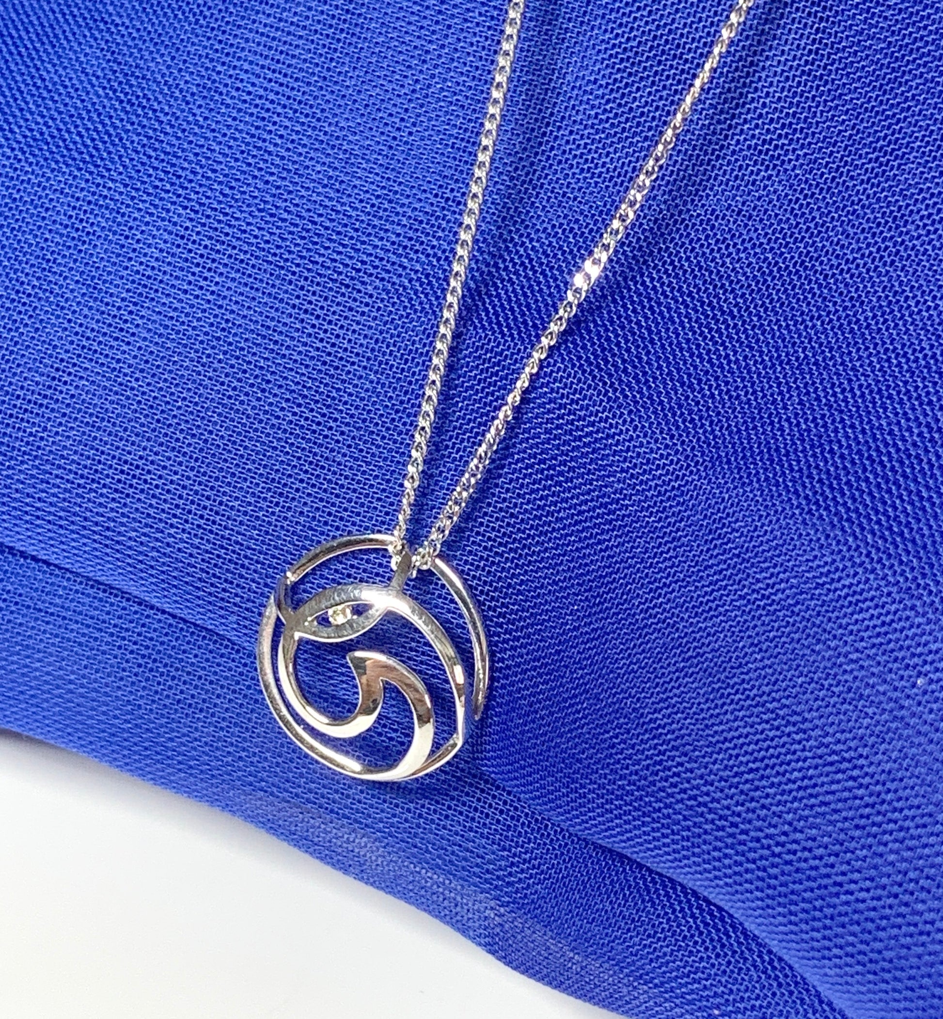 Diamond necklace white gold round open fancy swirl