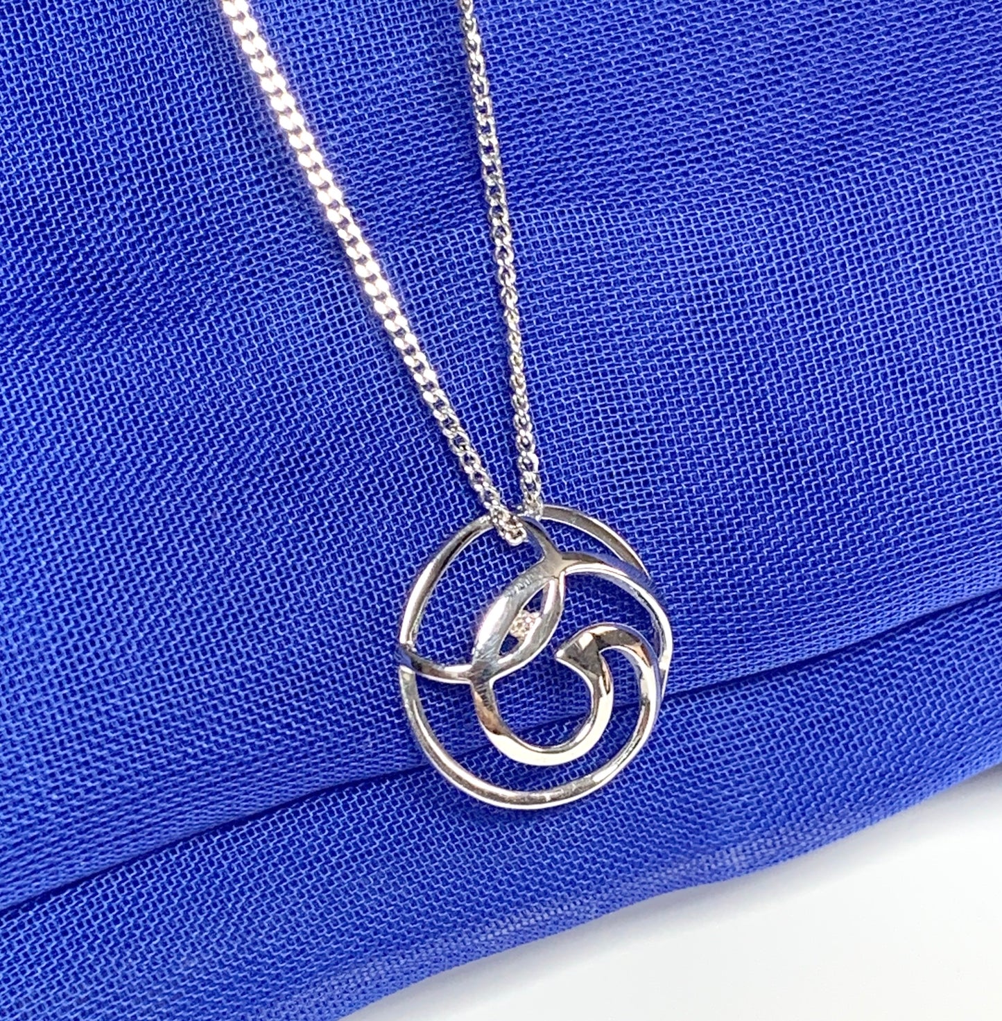 Diamond necklace white gold round open fancy swirl