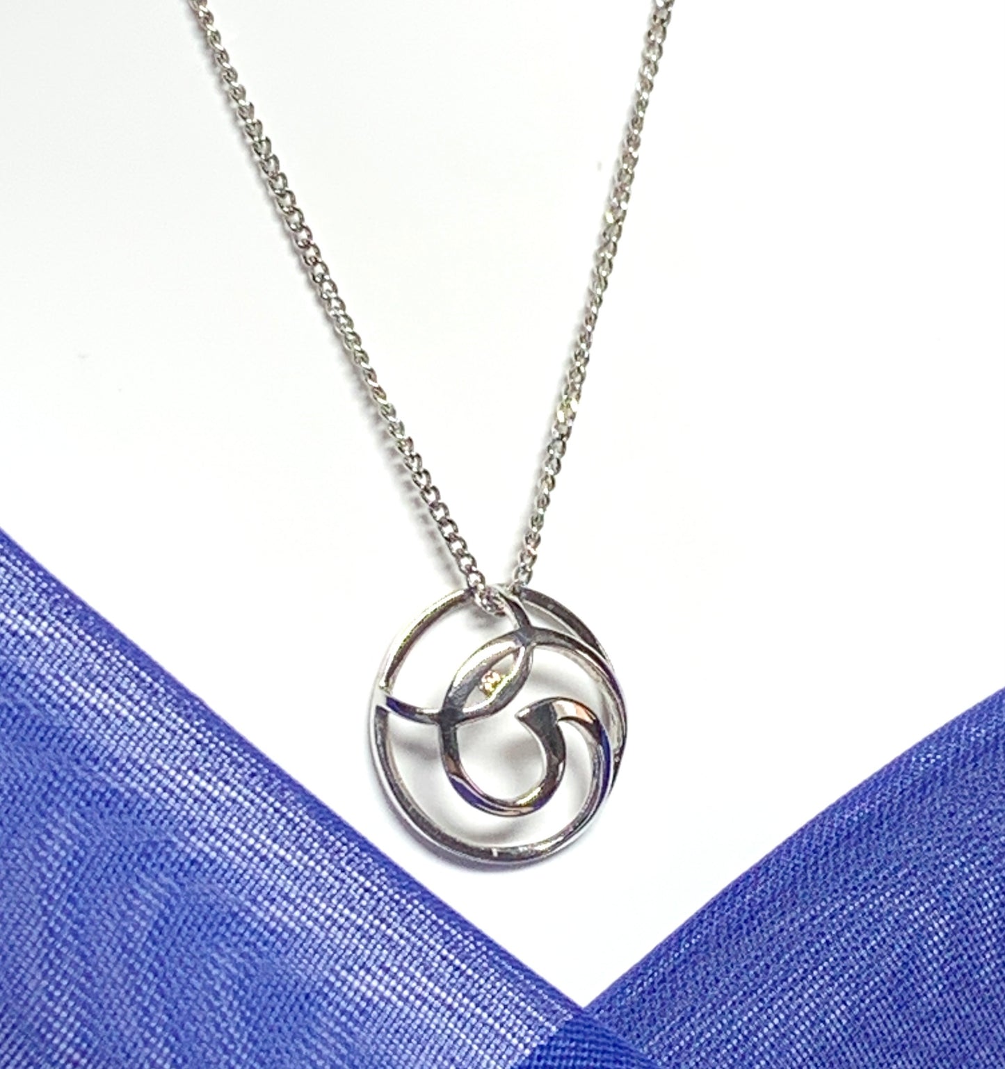 Diamond necklace white gold round open fancy swirl