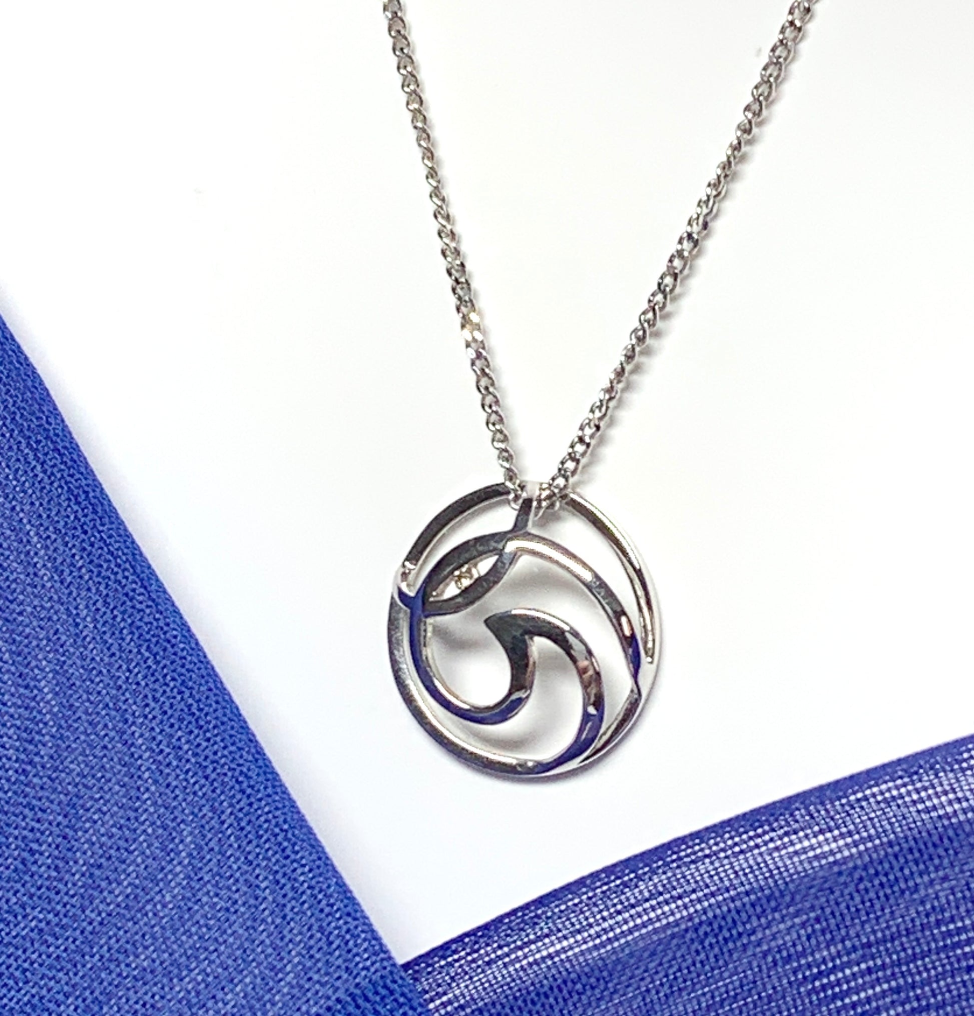 Diamond necklace white gold round open fancy swirl