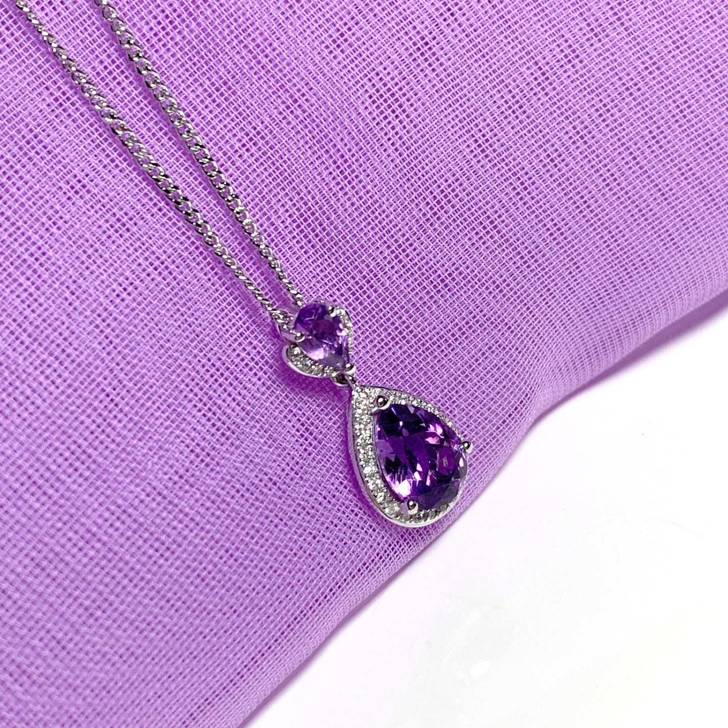 Double pear teardrop shaped purple amethyst and diamond white gold necklace pendant