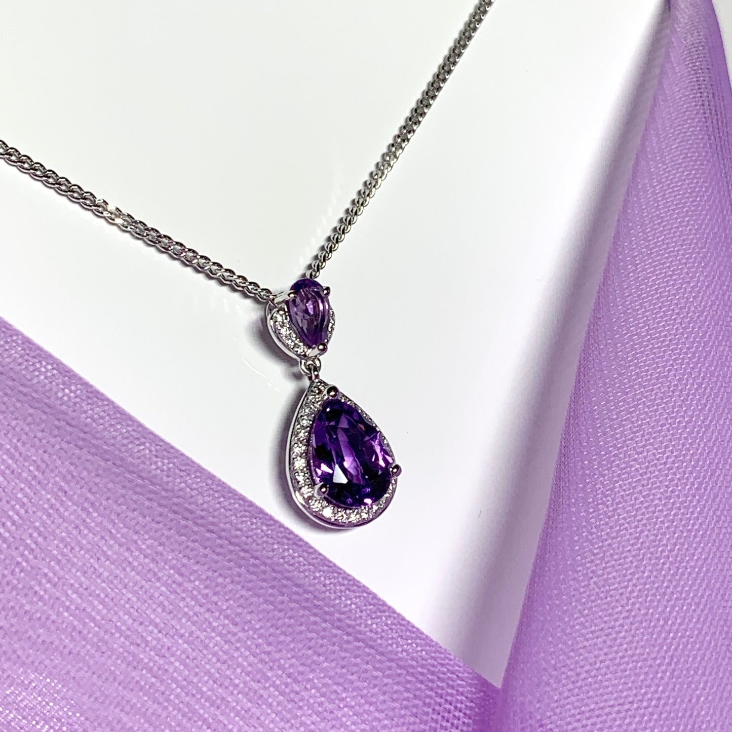 Double pear teardrop shaped purple amethyst and diamond white gold necklace pendant