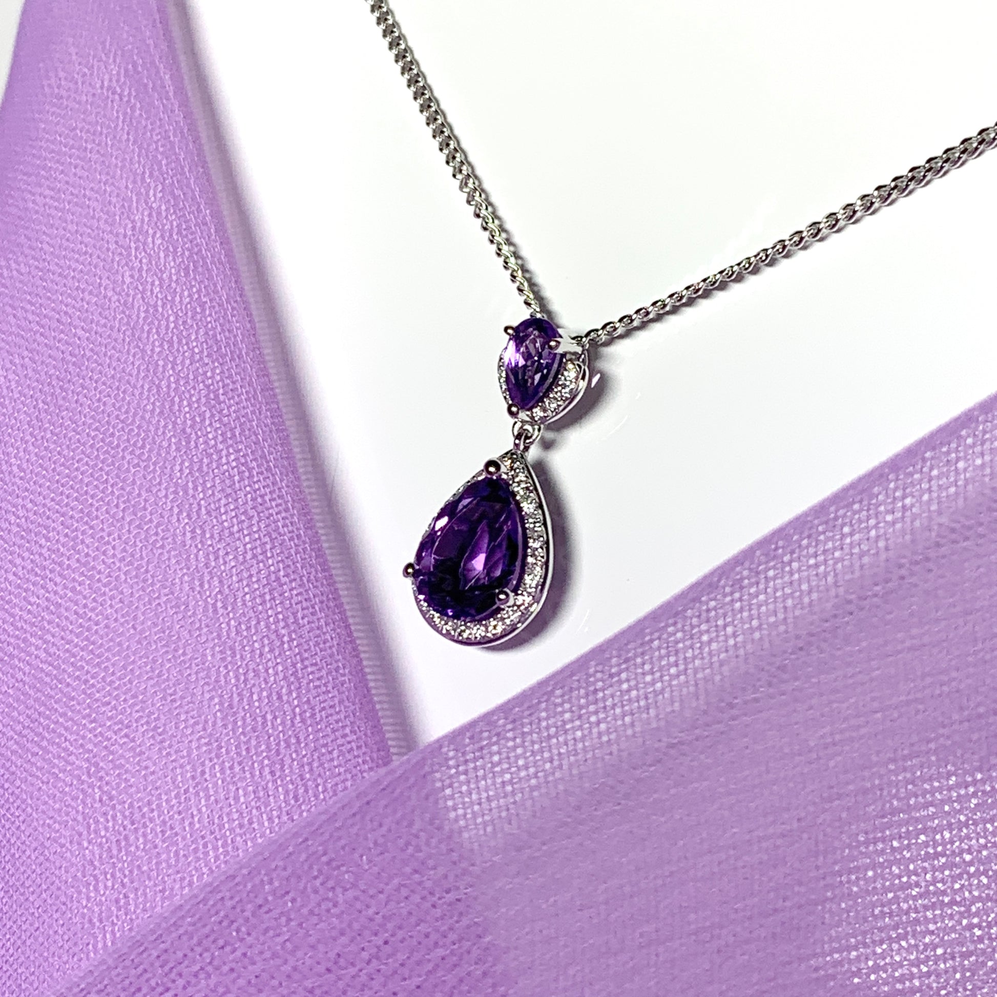 Double pear teardrop shaped purple amethyst and diamond white gold necklace pendant