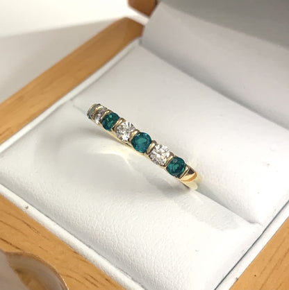 Tension Bar Set Emerald And Diamond Yellow Gold Eternity Ring