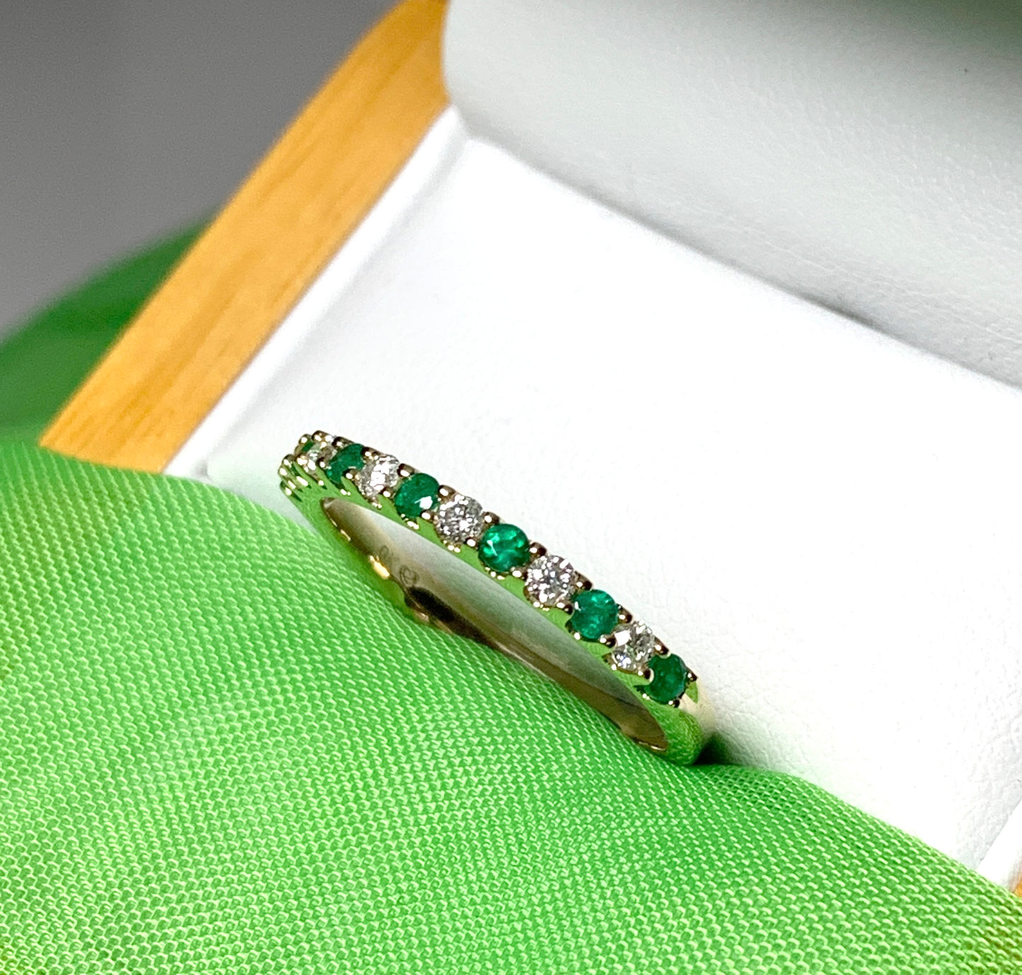 Real emerald and diamond yellow gold eternity ring