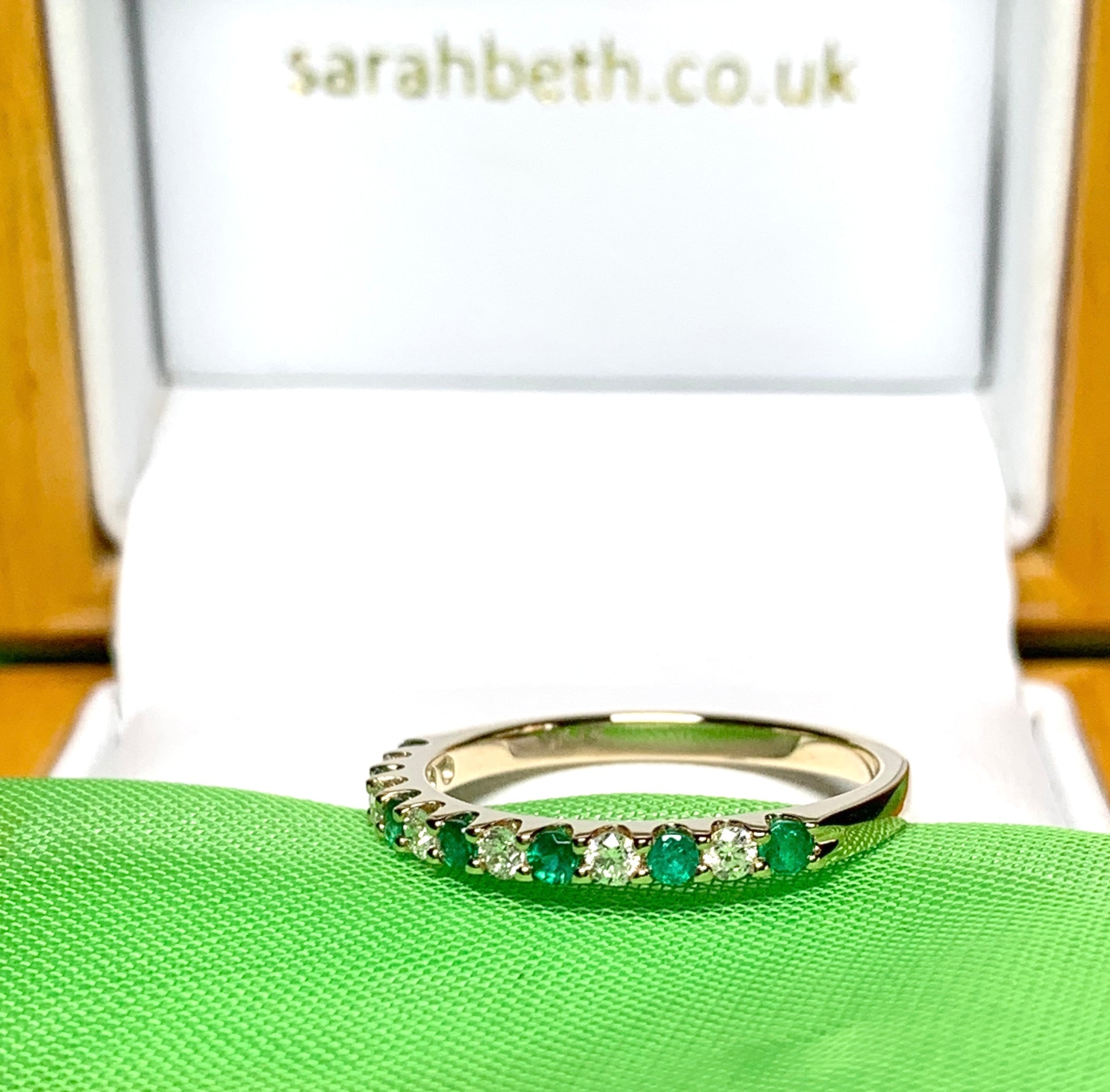 Real emerald and diamond yellow gold eternity ring