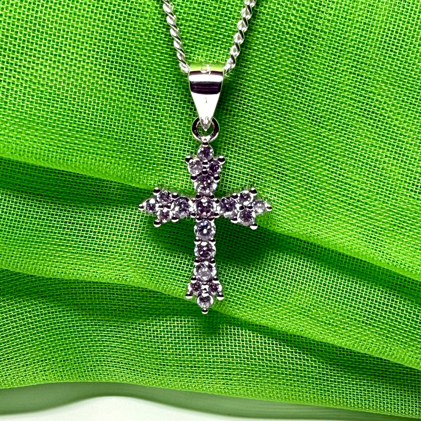 Fancy cubic zirconia set sterling silver cross with a chain