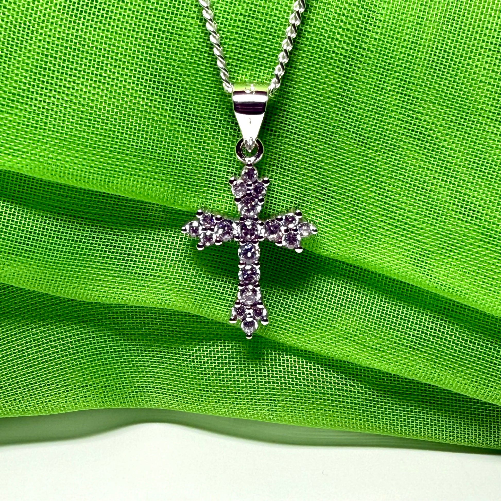 Fancy cubic zirconia set sterling silver cross with a chain