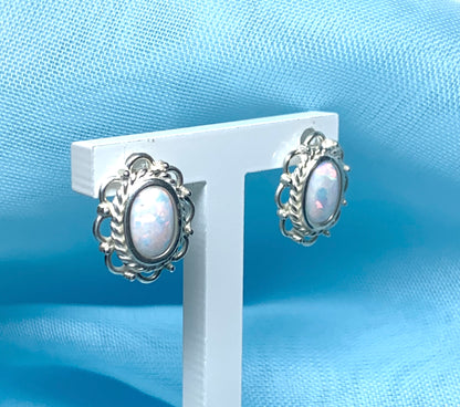 Fancy oval sterling silver opal stud earrings