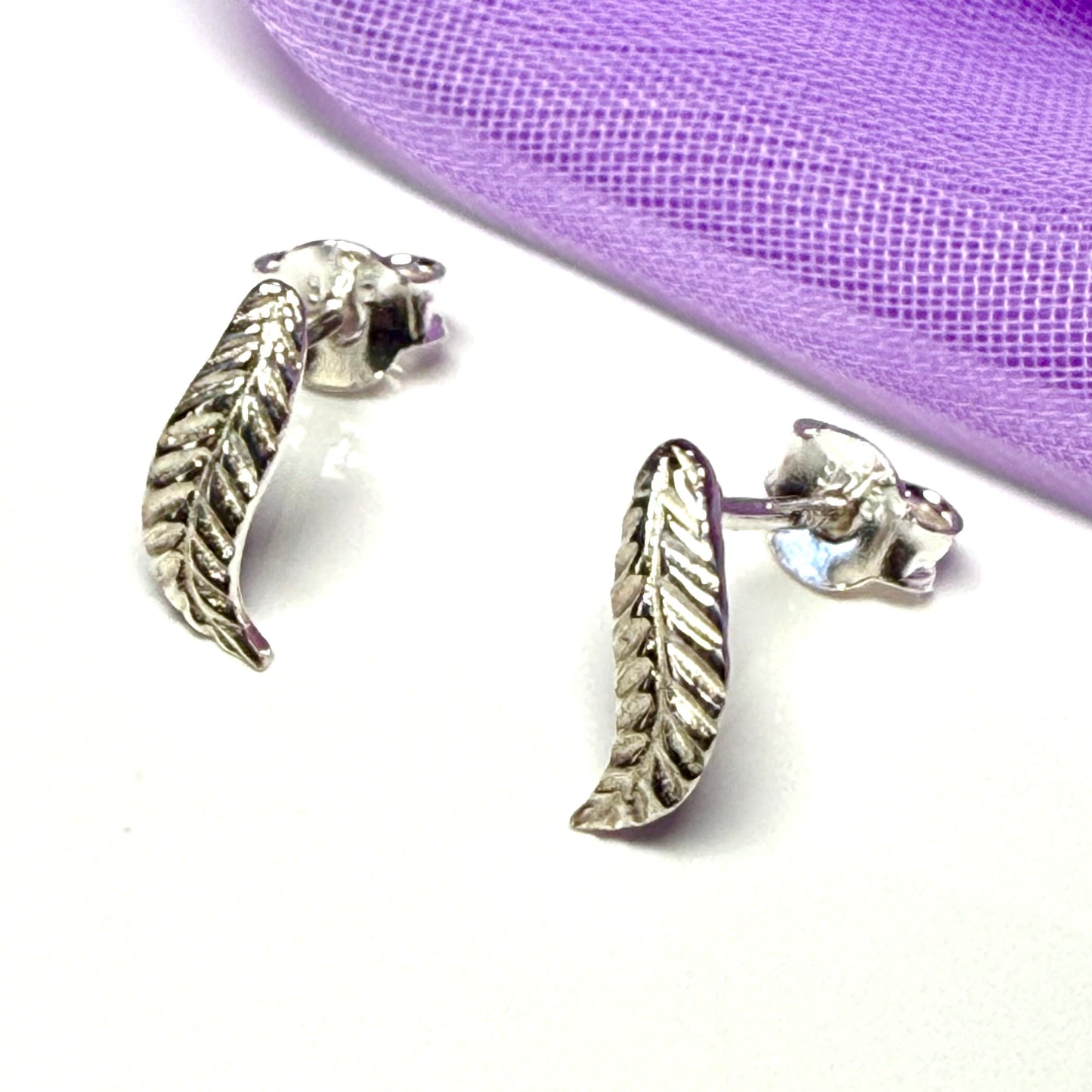 Feather shaped stud earrings sterling silver