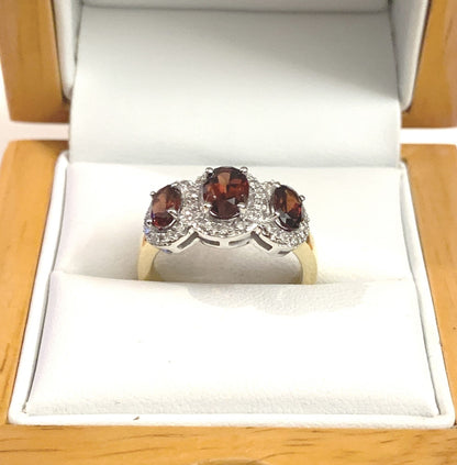 Garnet ring oval triple trilogy cluster with diamonds 18 carat yellow gold