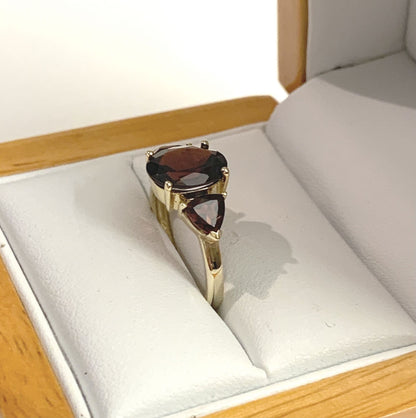 Real garnet trilogy dress ring yellow gold