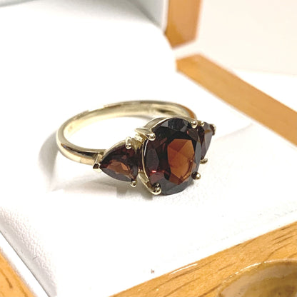 Real garnet trilogy dress ring yellow gold