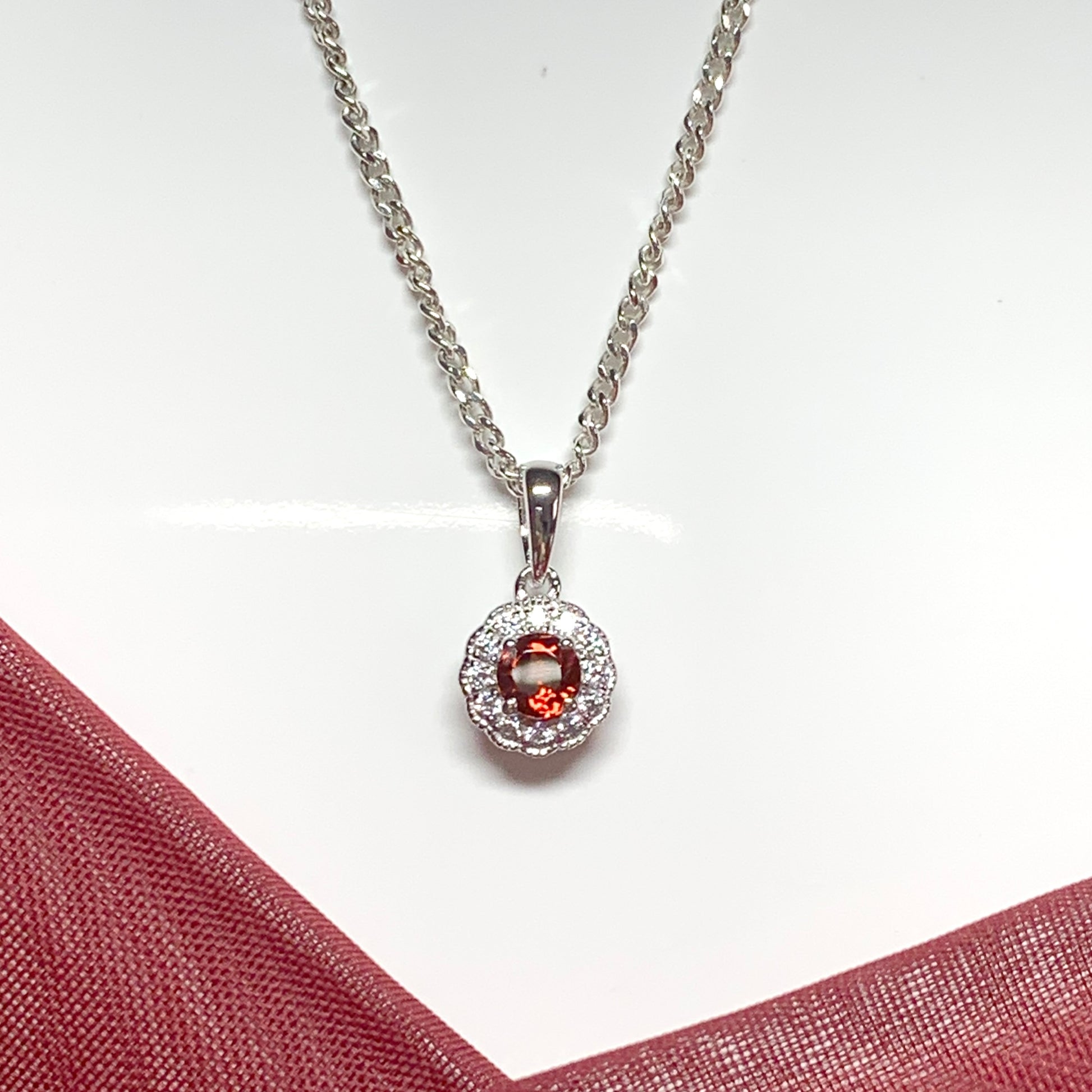 Garnet and cubic zirconia necklace sterling silver round dress cluster pendant