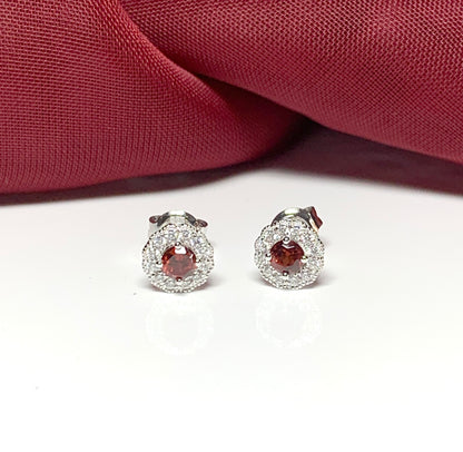 Garnet and cubic zirconia sterling silver round cluster stud earrings