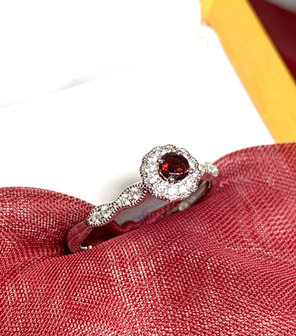 Garnet and cubic zirconia sterling silver round dress cluster ring