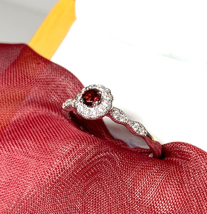 Garnet and cubic zirconia sterling silver round dress cluster ring