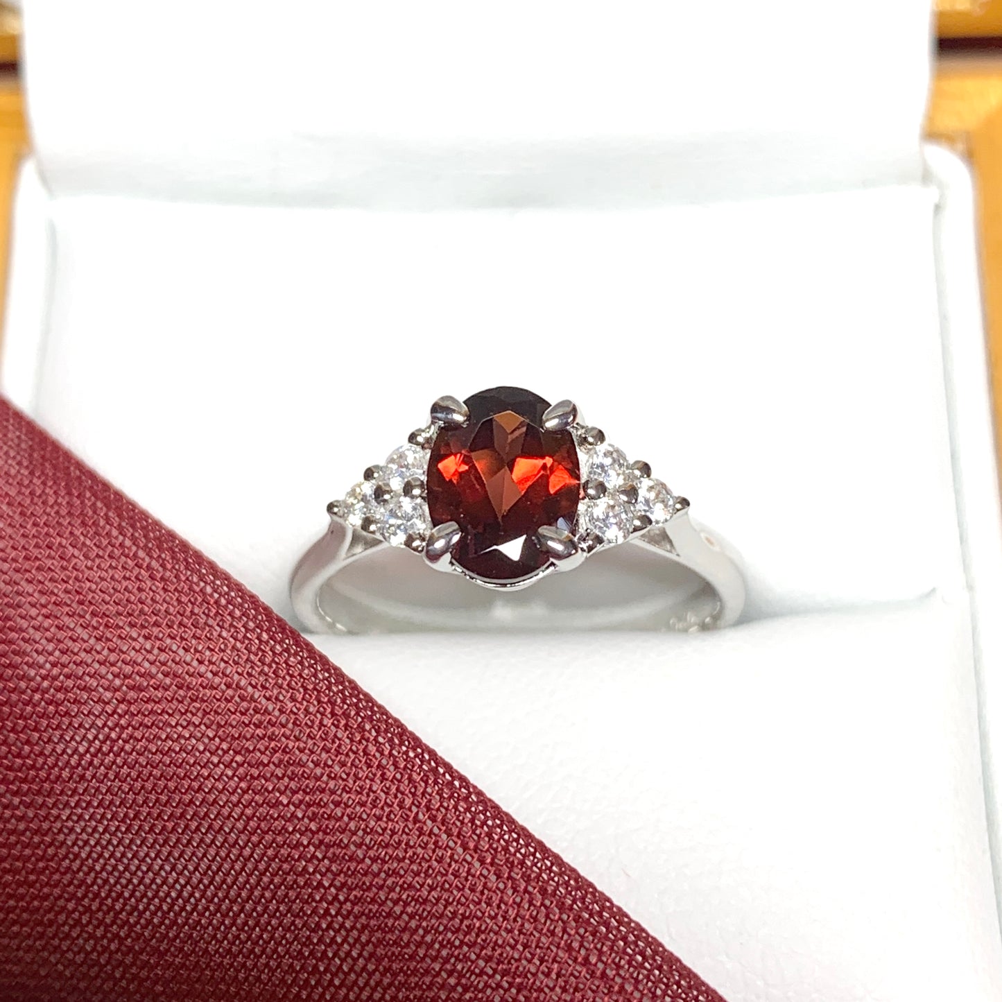 Garnet and cubic zirconia sterling silver oval dress ring