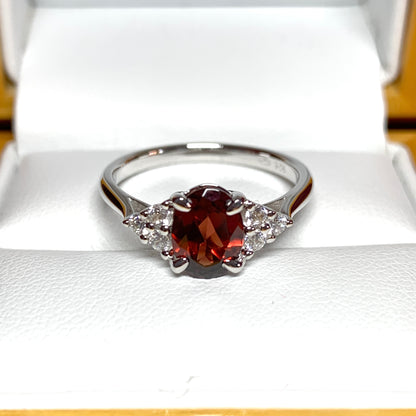 Garnet and cubic zirconia sterling silver oval dress ring