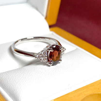 Garnet and cubic zirconia sterling silver oval dress ring