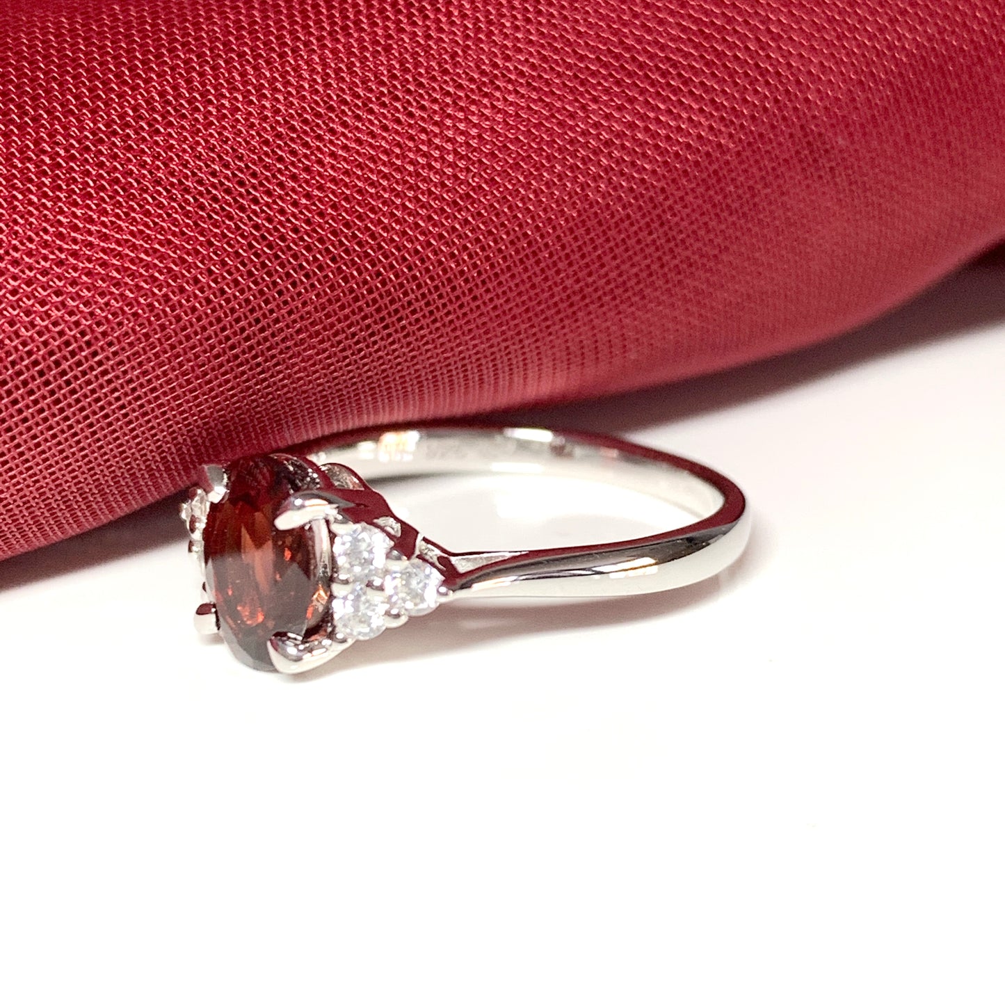 Garnet and cubic zirconia sterling silver oval dress ring