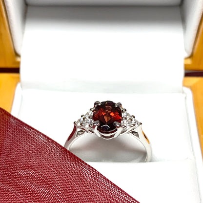 Garnet and cubic zirconia sterling silver oval dress ring