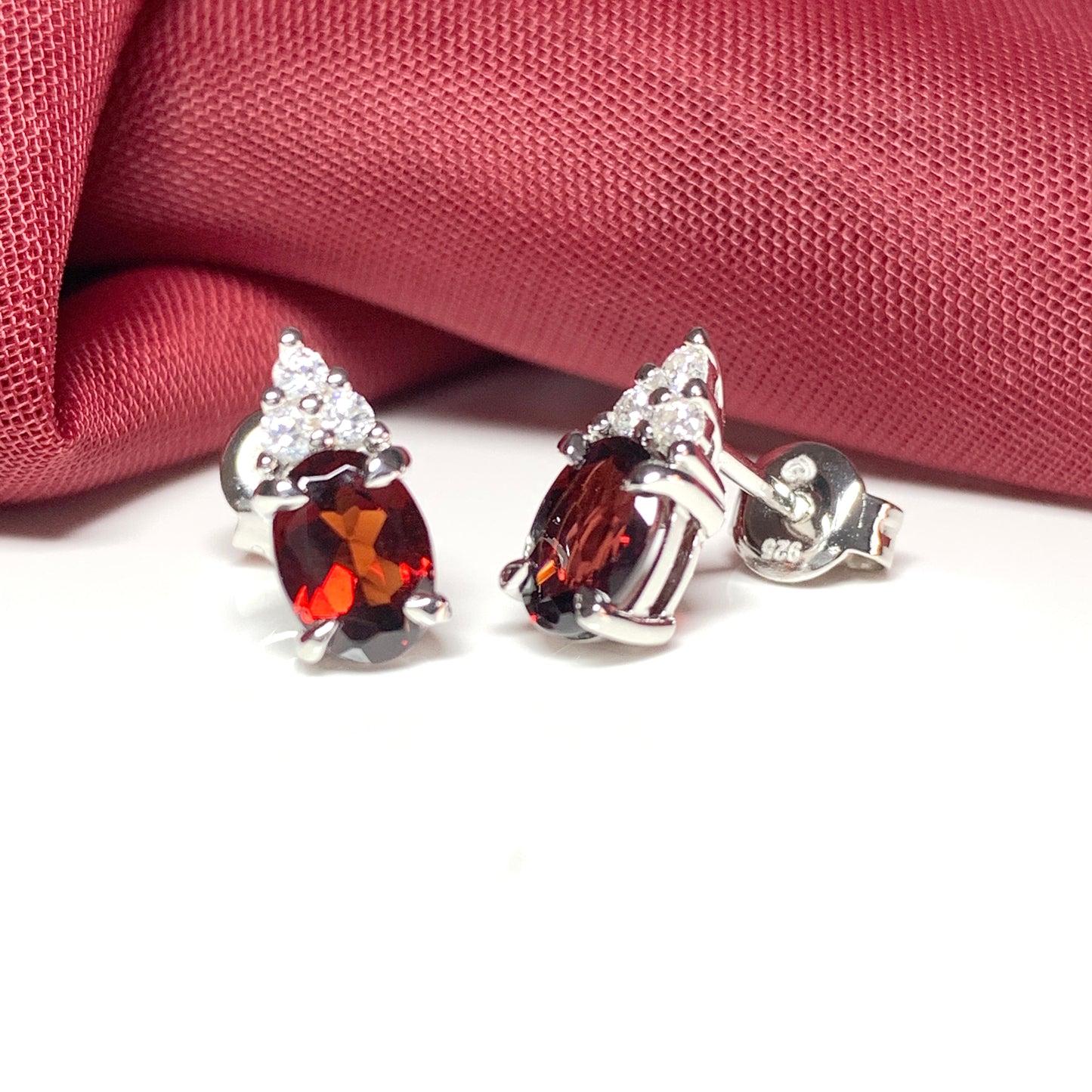 Garnet and cubic zirconia sterling silver oval earrings
