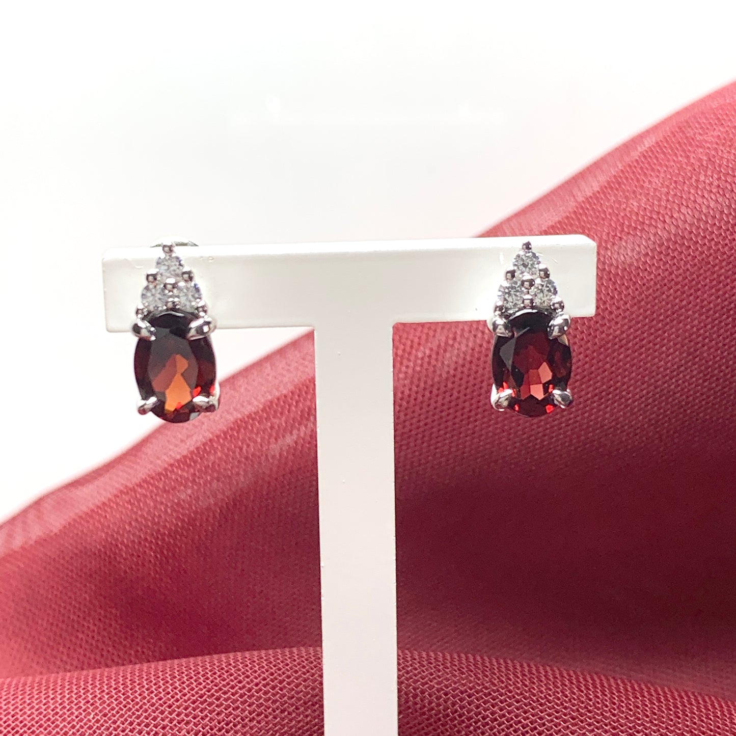 Garnet and cubic zirconia sterling silver oval earrings
