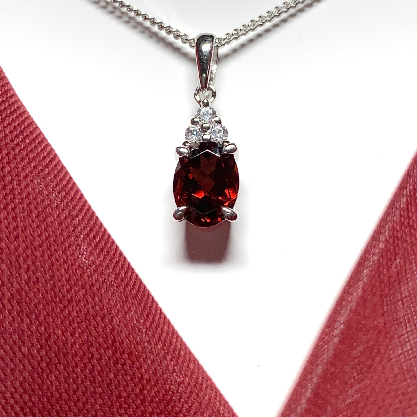 Garnet and cubic zirconia sterling silver oval necklace