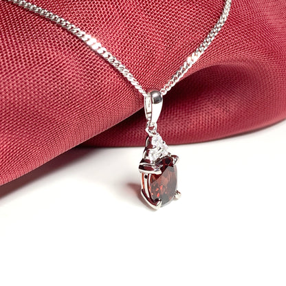 Garnet and cubic zirconia sterling silver oval necklace