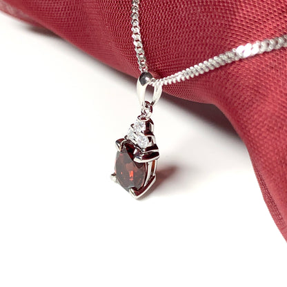 Garnet and cubic zirconia sterling silver oval necklace