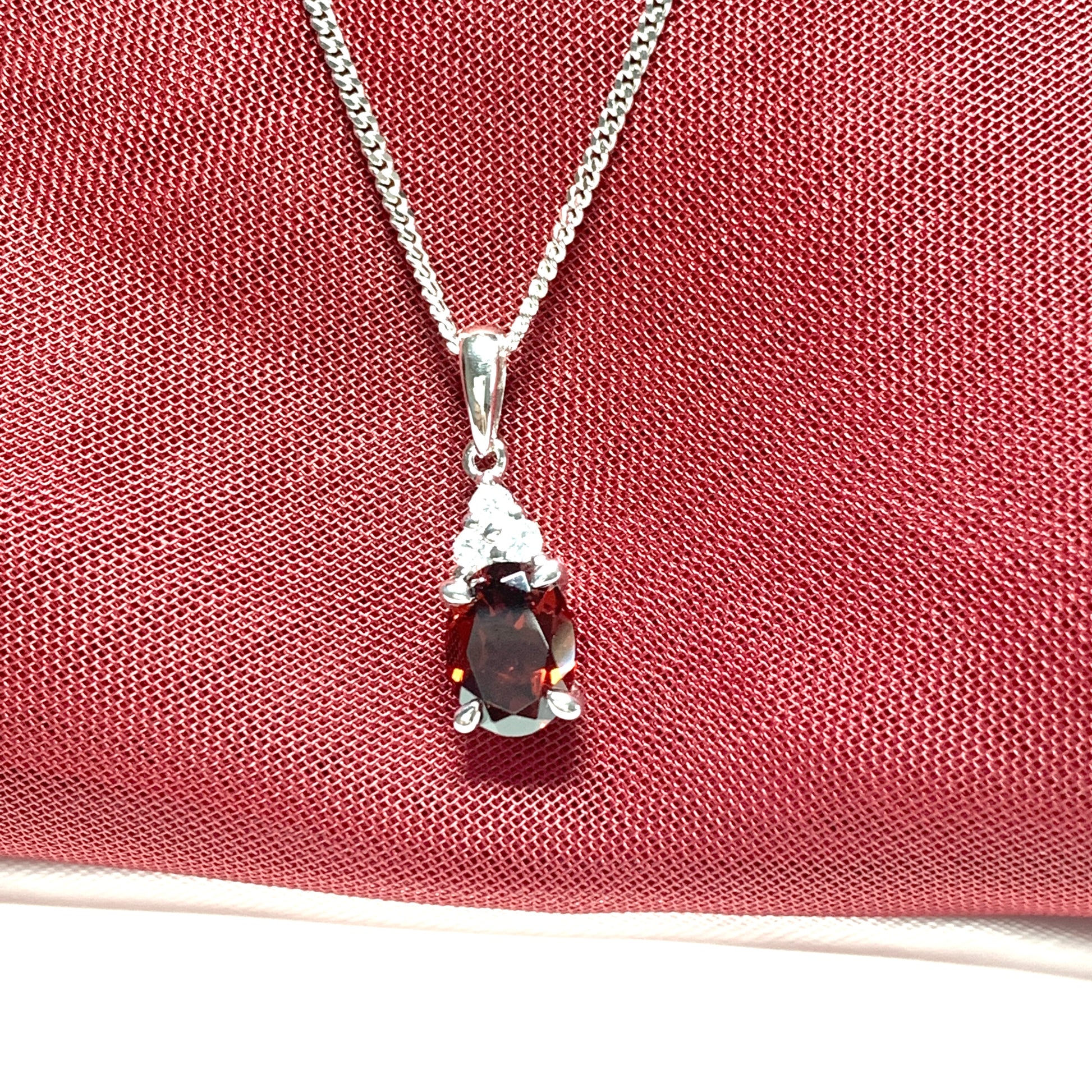 Garnet and cubic zirconia sterling silver oval necklace