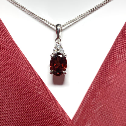 Garnet and cubic zirconia sterling silver oval necklace