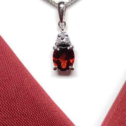 Garnet and cubic zirconia sterling silver oval necklace