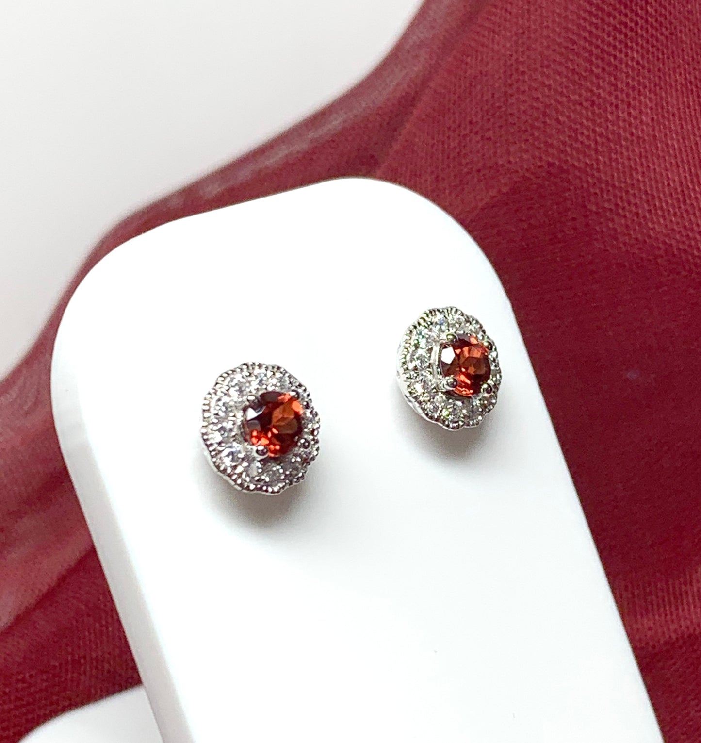 Garnet and cubic zirconia sterling silver round cluster stud earrings