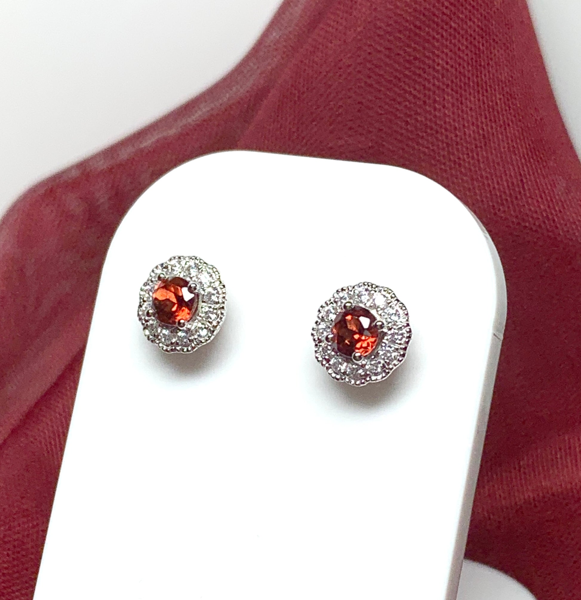 Garnet and cubic zirconia sterling silver round cluster stud earrings