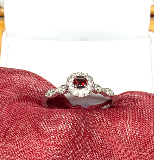 Garnet and cubic zirconia sterling silver round dress cluster ring