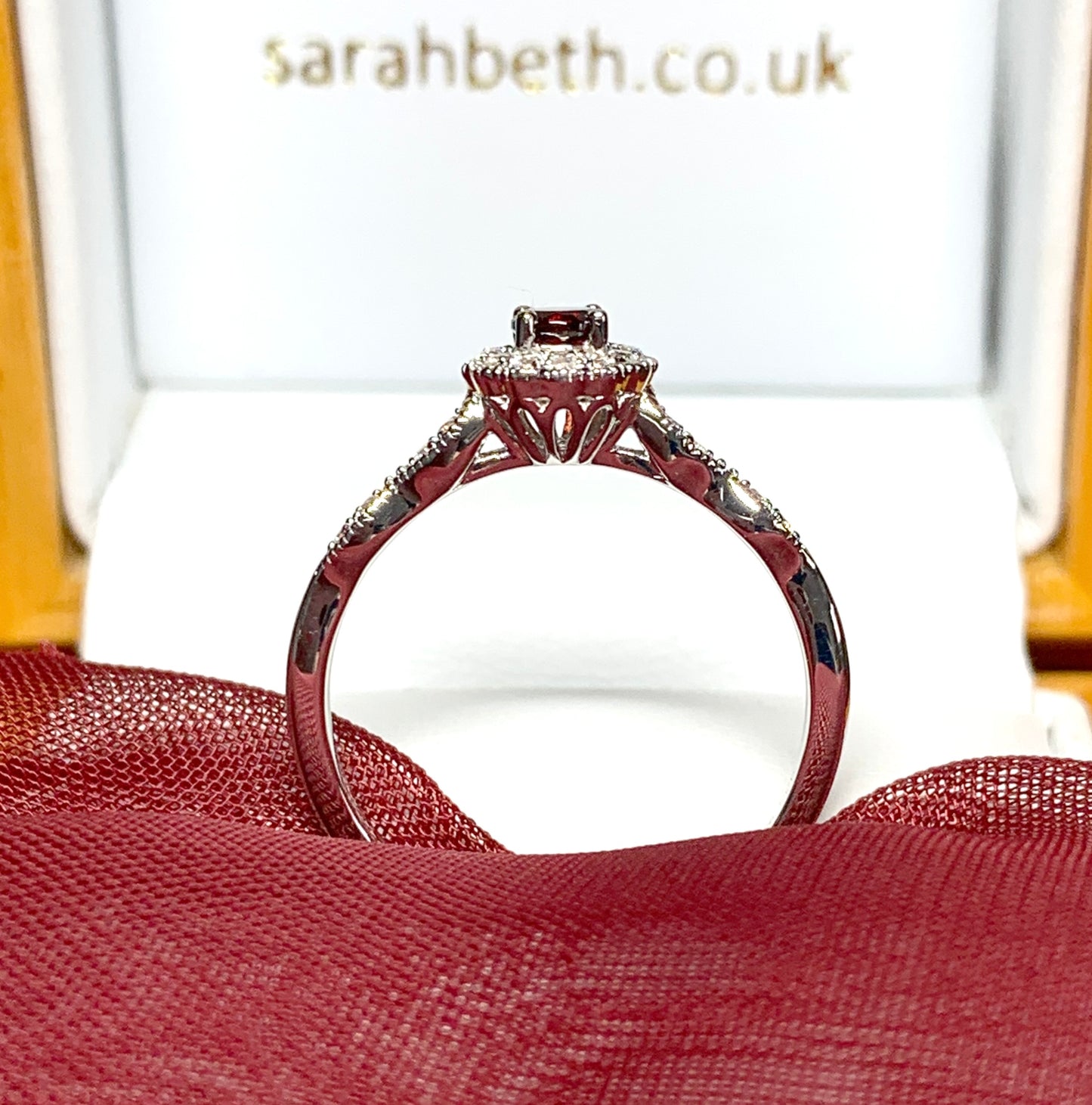 Garnet and cubic zirconia sterling silver round dress cluster ring